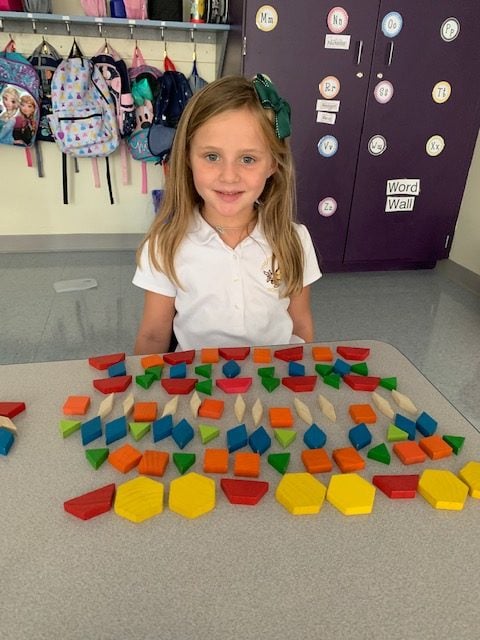 Kindergartener reviewing shapes